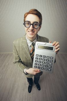 A nerdy guy with a giant-sized calculator 