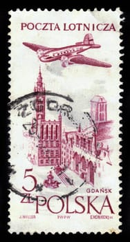 POLAND - CIRCA 1957: a stamp printed in Poland shows plane flying over Gdansk, circa 1957