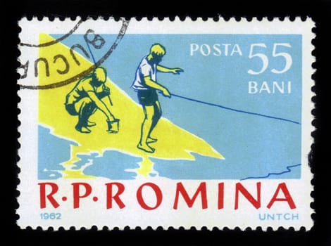 ROMANIA - CIRCA 1962: A stamp printed in the Romania shows boys on a fishing trip, circa 1962.