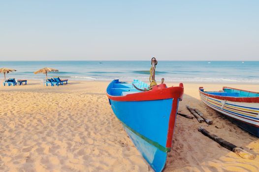 Two sailing boats on the sandy beach