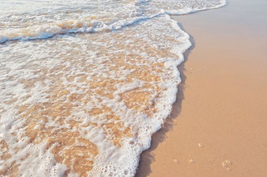 Soft wave of the sea on the sandy beach