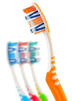 Composition with toothbrushes isolated on white background