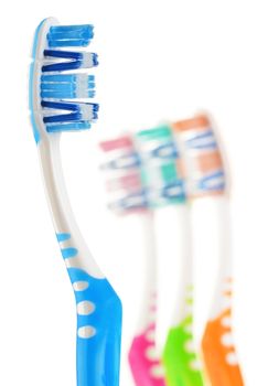 Composition with toothbrushes isolated on white background