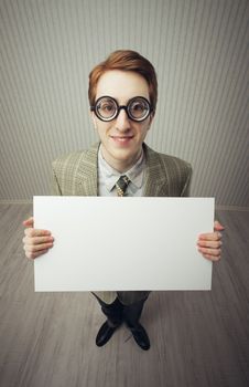 Business man nerd holds a blank sign, ready for your text, old style image