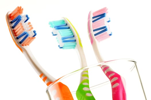 Composition with toothbrushes isolated on white background