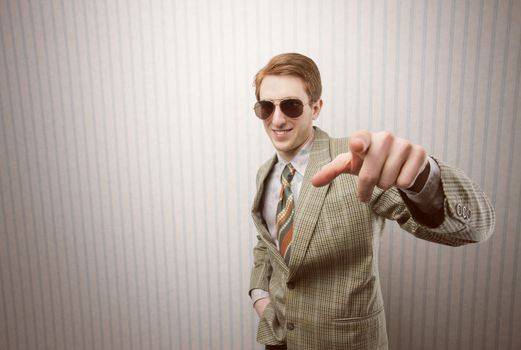 Funny retro businessman pointing his finger at you