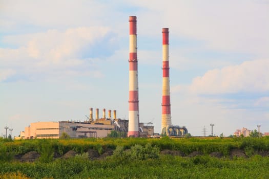 Rural landscape with a view on factory