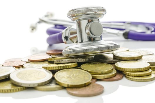 Stethoscope over Euro coins. Concept of saving bad economy. 