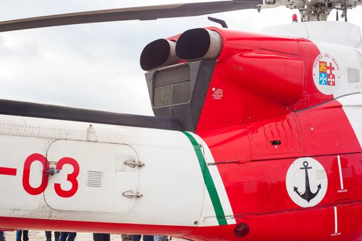 Side view of a helicopter on the ground