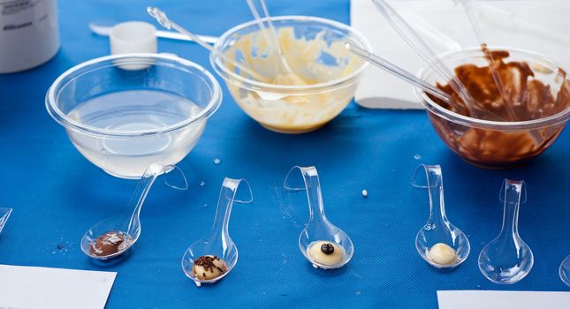 Photo of Cream and chocolate on spoons