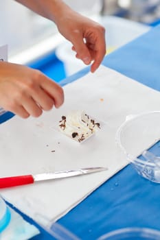 Woman preparing a dessert with cream