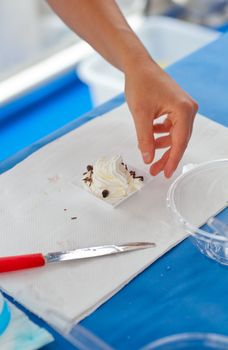 Woman preparing a dessert with cream