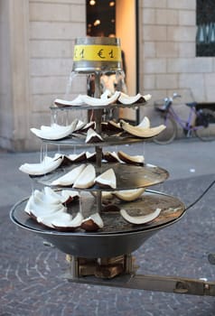 Sliced coconut inside a fountain