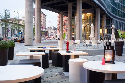 Little tables and stools in a outdoor pub