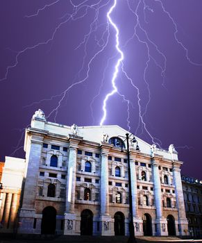 Frustrated businessman, Exchange building under thunderbolts in Milan - Italy