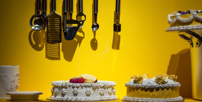 Cake in the kitchen on yellow background