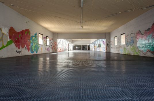 View of tunnel with graffiti in Trieste