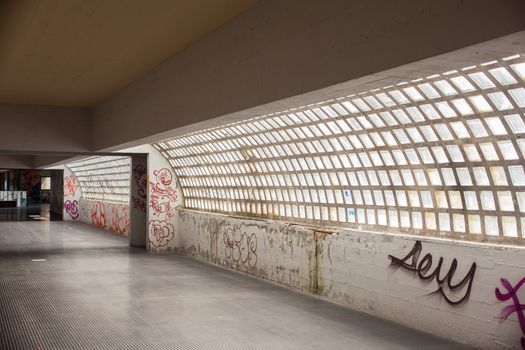 View of tunnel with graffiti in Trieste