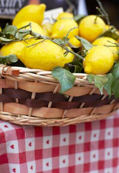 Photo of Wicker basket with ripe lemons