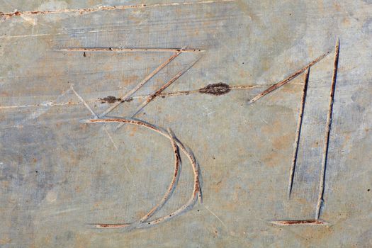 Photo of Numbers thirty-one etched in stone