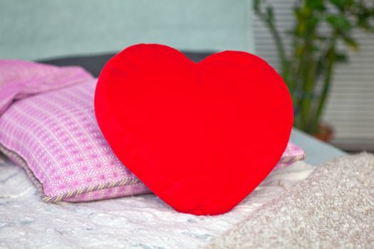 Photo of Pillow heart on the bed
