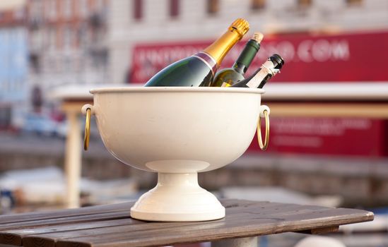 Bottles of sparkling wine in a tub with ice