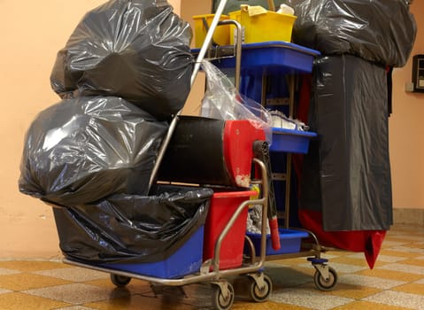Blach garbage bags on janitor cart