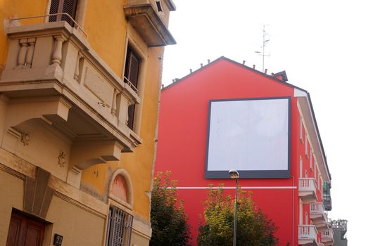 Billboard on a red house for various advertising