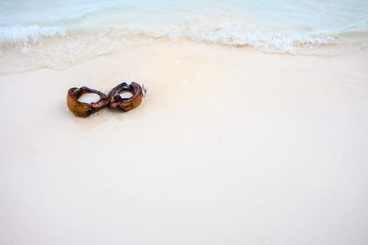 Half coconut on beach