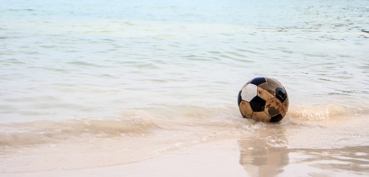 Old ball lonely on thebeach