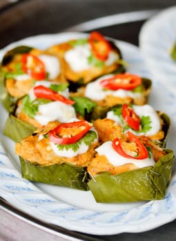 Steamed fish with curry paste on dish