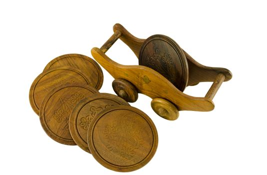 wooden ornamented pallet holder on casters and side round five coaster isolated on white background.