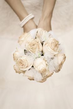 beauty wedding bouquet of roses in a bride hands. retro style