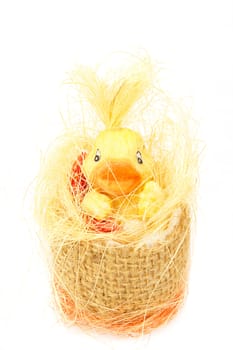 yellow easter decoration with small duck on white background
