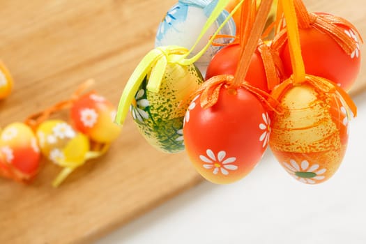 hanged bright color easter eggs with bows