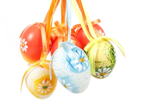 hanged bright color easter eggs with bows isolated on white background