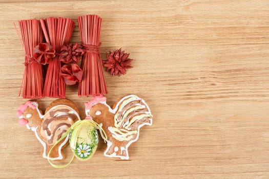 Easter ginger breads,egg and painted egg on wooden background