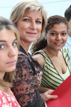 Female teacher stood with her students