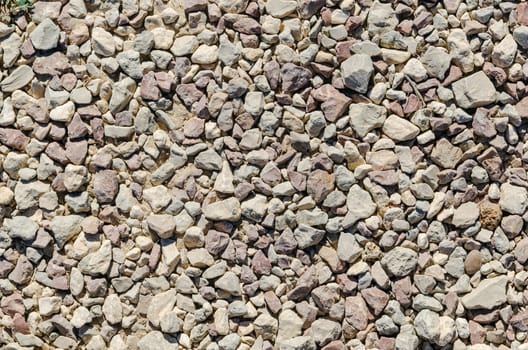 texture of many multicolored granite small stones. Natural pattern