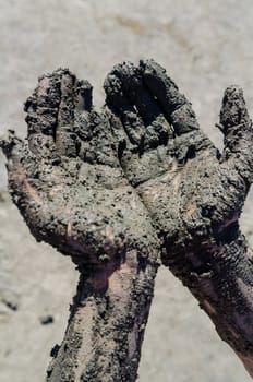 take a mud cure. healthy medical procedure. dirty hands