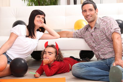 Parents with children dressed as devil