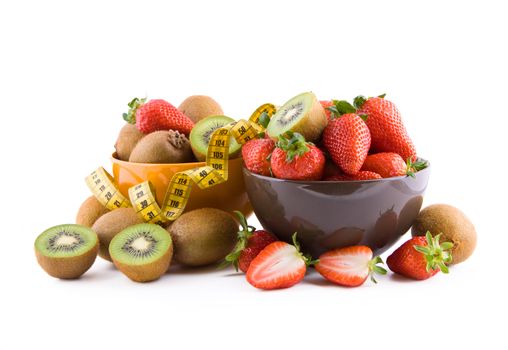 Fresh strawberries and kiwi in a porcelain bowls