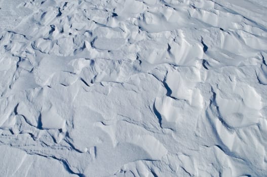 Close up of windy white snow surface texture