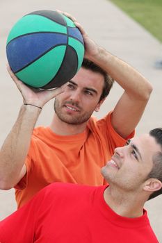 Young people playing basketball