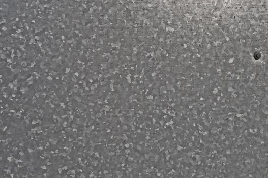 CLose up of gray zinc-coated metal surface