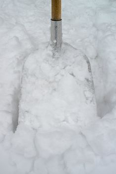 Snow shovel in a deep snow, winter is here