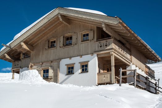 Beautiful skiing hut in a valley of Montafon, photo taken from public skiing piste