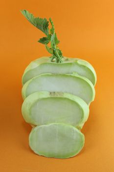 Cabbage kohlrabi on orange background