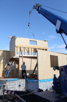 Wooden house frame being built