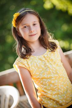 Young girl smiling and standing